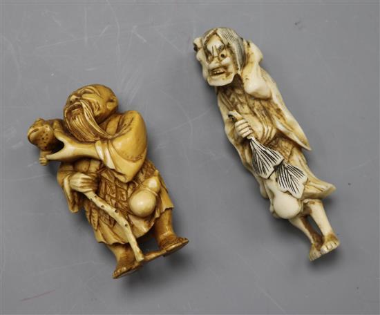 Two 19th/early 20th century Japanese netsuke of Gama Sennin holding a toad, in ivory and stag horn, (523, 600)